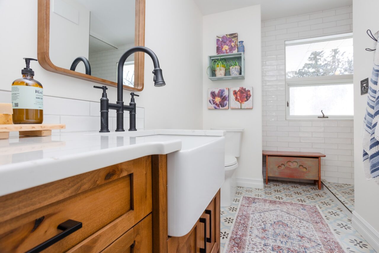 Rustic Knotty Alder Bathroom with Apron front sink and gooseneck faucet.